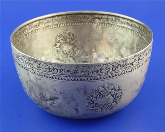 An early 20th century Burmese? silver circular bowl, 9 oz.